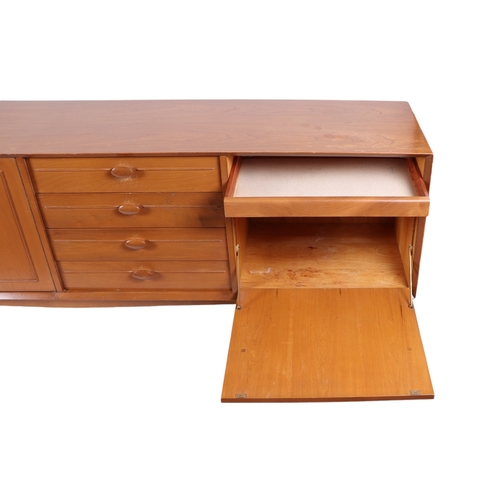 819 - A mid century modern 1960's teak sideboard with an arrangement of four central drawers flanked by a ... 