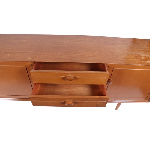 819 - A mid century modern 1960's teak sideboard with an arrangement of four central drawers flanked by a ... 