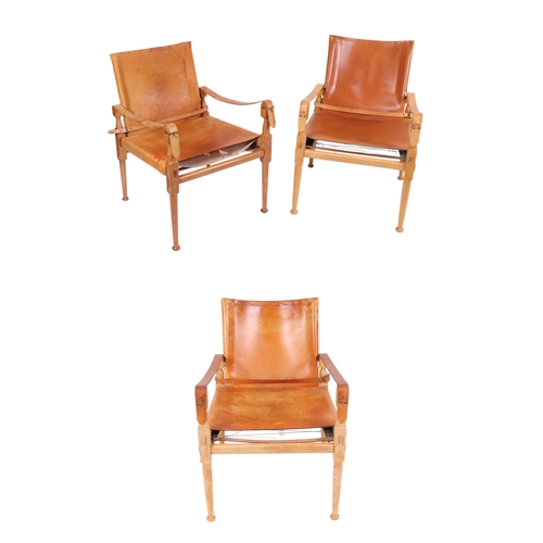 814 - Manner of Borge Mogensen ( 20th century Danish) - A set of three modern design Campaign style chairs... 