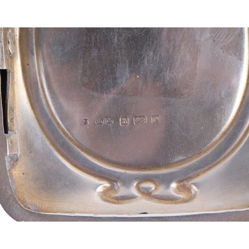 1106 - An Edwardian silver cigarette case with equestrian interest, the cover with embossed decoration in t... 