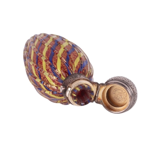 1109 - A Victorian unmarked silver ribbed glass scent bottle with internal blue, yellow and gilt cranberry ... 