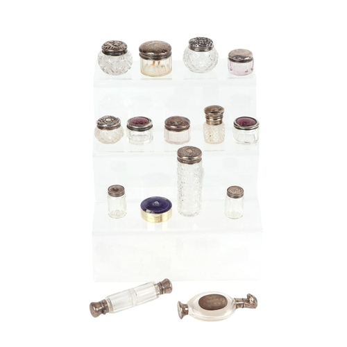 1145 - A small quantity of silver capped scent bottles and rouge pots, various dates and makers marks.