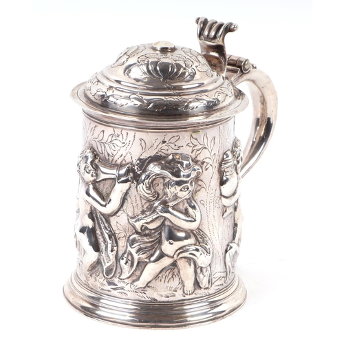 1150 - A large George I silver lidded tankard with embossed Bacchanalian figures in a procession, London 17... 