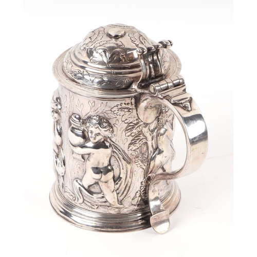 1150 - A large George I silver lidded tankard with embossed Bacchanalian figures in a procession, London 17... 