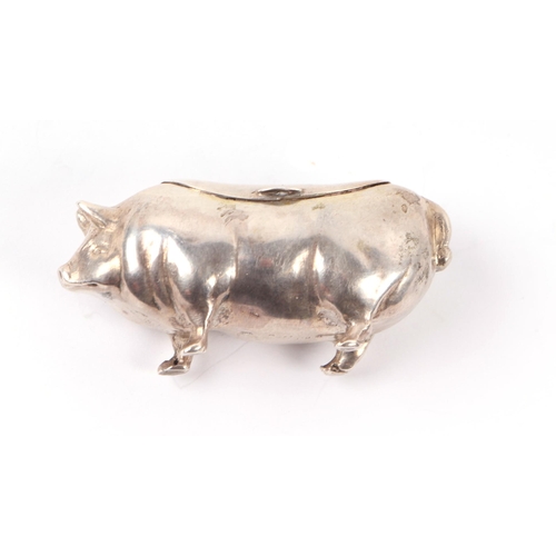 1157 - A Georgian silver vinaigrette, marks rubbed; together with a silver box in the form of a pig, 5cms l... 