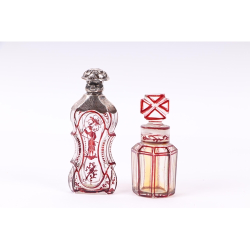 1170 - A Victorian silver mounted ruby flashed glass scent bottle of waisted form, 11cms high; together wit... 