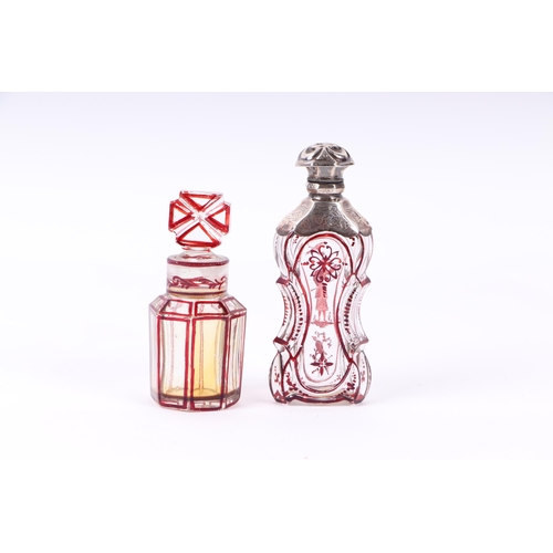 1170 - A Victorian silver mounted ruby flashed glass scent bottle of waisted form, 11cms high; together wit... 