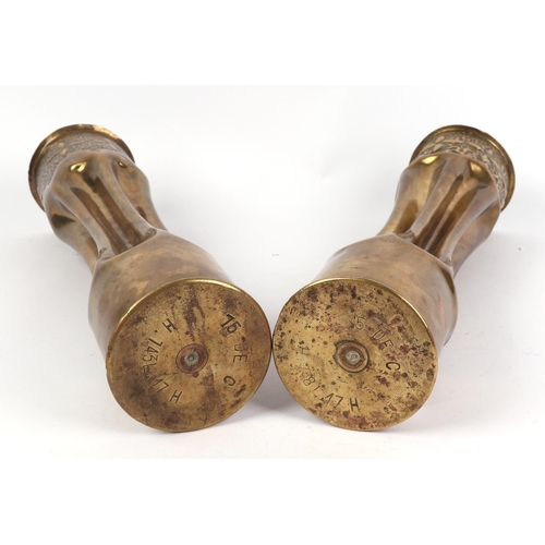 123 - A pair of WWI artillery shells converted to vases in the Art Nouveau style, 34cms high 92).