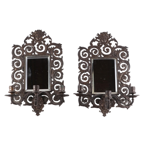 1637 - A pair of bronze mirror backed three-arm wall sconces, 27cms by 44cms (2).