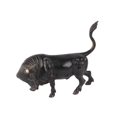 1639 - A Vienna cold painted bronze figure of a bull (lacking horns), 14cms long.