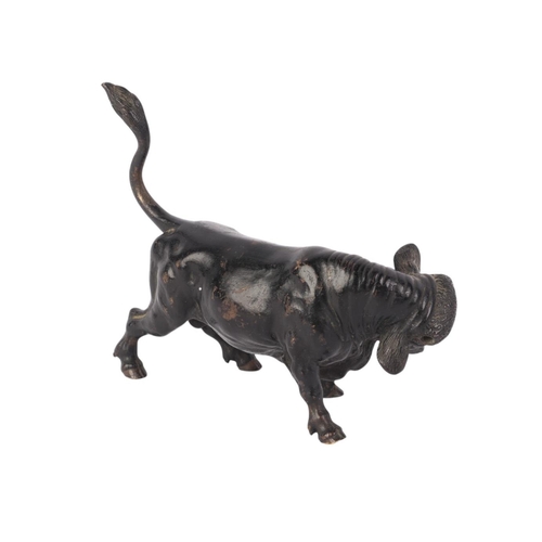 1639 - A Vienna cold painted bronze figure of a bull (lacking horns), 14cms long.