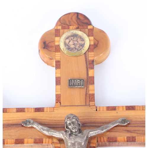 1643 - An inlaid Jerusalem olivewood crucifix with silver plated figure of Christ, 38cms high.