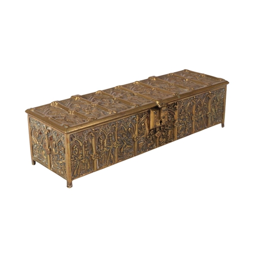 1648 - A brass candle box in the Gothic Revival taste, 30cms wide.