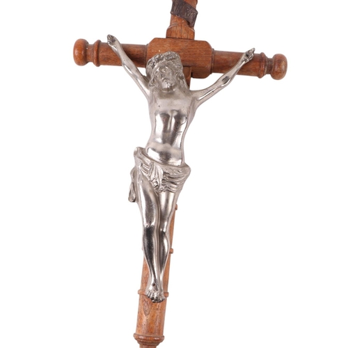 1650 - A Corpus Christi mounted on a wooden cross, 46cms high; together with another 47cms high (2).