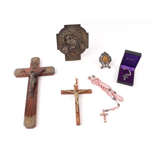 1651 - A Corpus Christi mounted on a wooden crucifix, 30cms high; together with another, 15cms high; Rosary... 