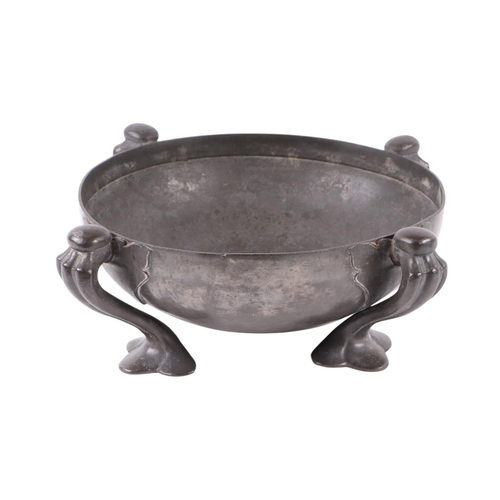 1702 - An Arts & Crafts Tudric pewter bowl designed by Oliver Baker, 26cms diameter.