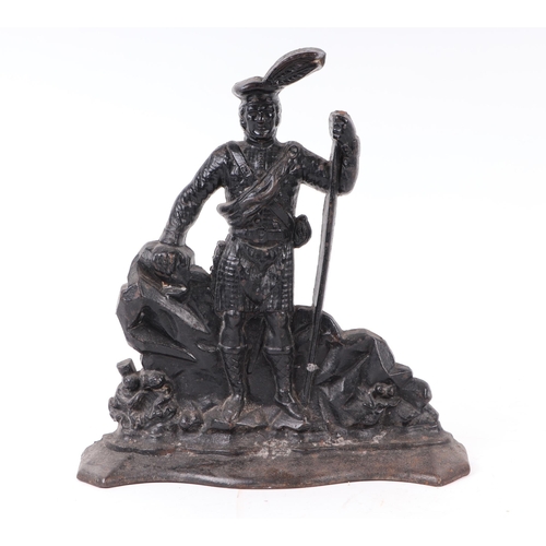 1711 - A Victorian cast iron door stop in the form of a highlander, 35cms high.