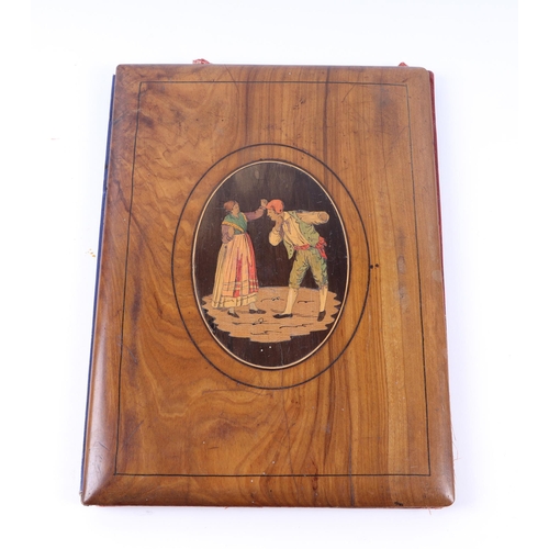 1713 - An Italian olivewood Sorrento ware desk blotter with oval inlaid panel depicting peasants, 19 by 26c... 