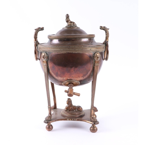 1714 - A Regency Egyptian Revival style copper and brass samovar with sphynx finial and phoenix head ring h... 