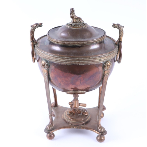 1714 - A Regency Egyptian Revival style copper and brass samovar with sphynx finial and phoenix head ring h... 