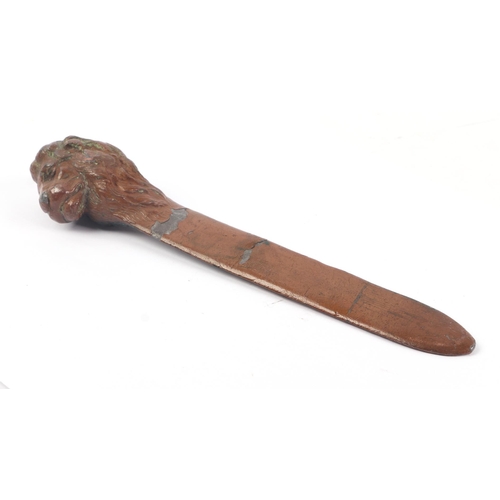 1715 - A lead letter knife with lion head terminal, 19cms long.