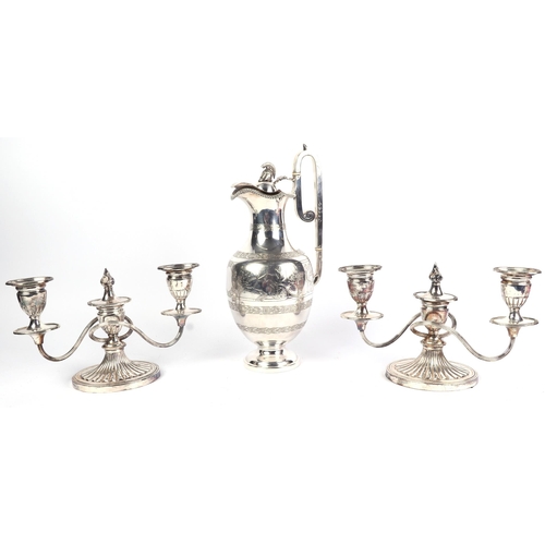 1815 - A Victorian silver plated three-piece tea and coffee set; together with a pair of three-branch silve... 