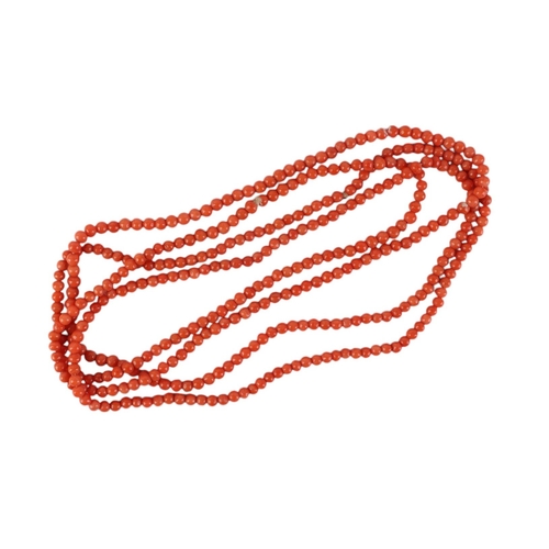 1935 - A long coral bead necklace, 140cms circumference.