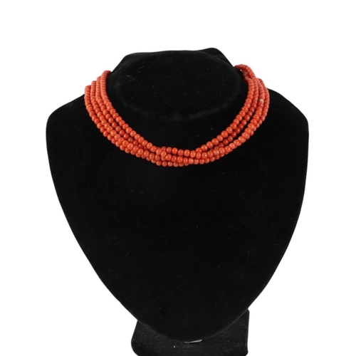 1935 - A long coral bead necklace, 140cms circumference.