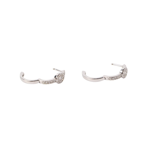 1943 - A pair of 18ct white gold diamond set hoop earrings, 2.3g.