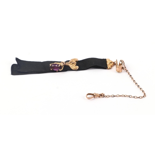 1944 - A gilt metal mounted ribbon Albertina with amethyst set fob.