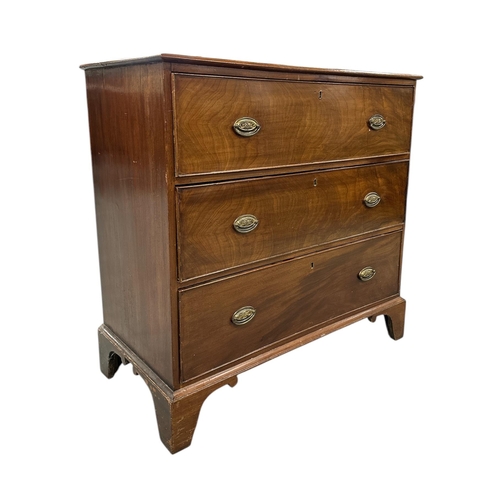 2483 - A 19th century mahogany chest of three long drawers, on bracket feet, 97cms wide.