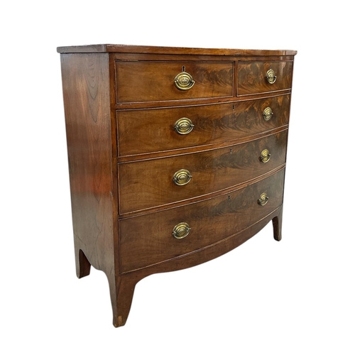 2484 - An early 19th century figured mahogany bowfront chest of two short and three graduated long drawers,... 