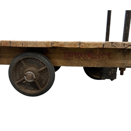 2524 - An early 20th century Slingsby Trucks porter's trolley, 95cms long.