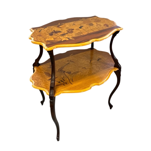 2527 - In the manner of Émile Gallé, an early 20th century marquetry inlaid two-tier occasional table, 72cm... 