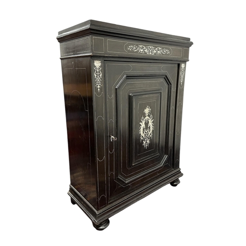 2528 - A 19th century Italian ebony and inlaid ivory Pier cabinet with single door and central panel inlaid... 