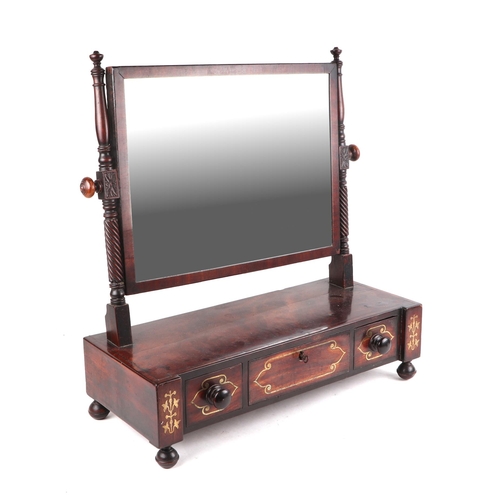 2534 - A 19th century toilet mirror with three short drawers, on bun feet, 56cms wide.