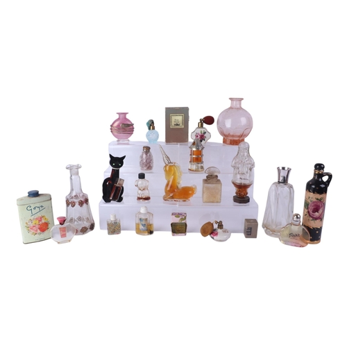 28 - A large quantity of vintage glass scent bottles, some with original contents.