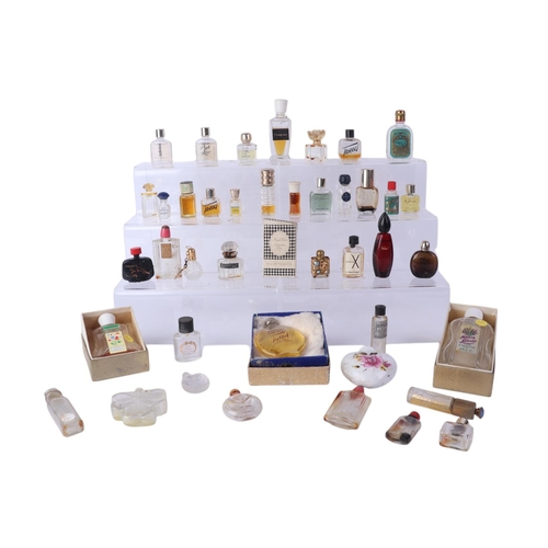 28 - A large quantity of vintage glass scent bottles, some with original contents.