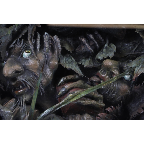 283 - A vintage papier-mâché Gothic Nightmare Fantasy diorama, three goblins emerging from deep undergrowt... 