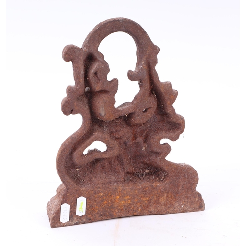 296 - A Victorian cast iron doorstop in the form of a stylised lion, 26cms high.