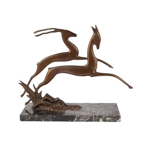 303 - An Art Deco bronze figure of two leaping deer, on a figured marble base, 28cms high.