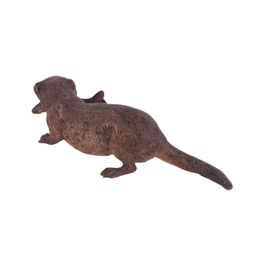 306 - A large Vienna cold painted bronze figure of an otter with a fish in its mouth, 17.5cms long.