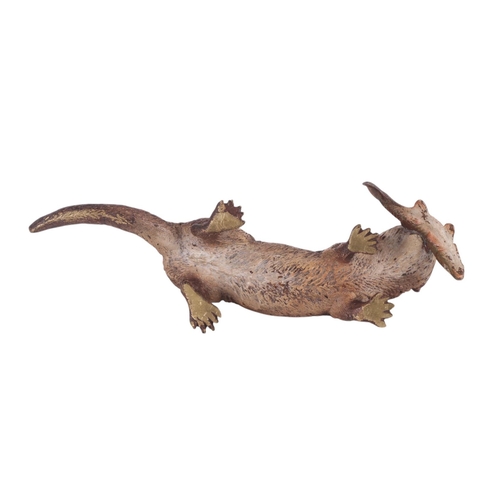 306 - A large Vienna cold painted bronze figure of an otter with a fish in its mouth, 17.5cms long.