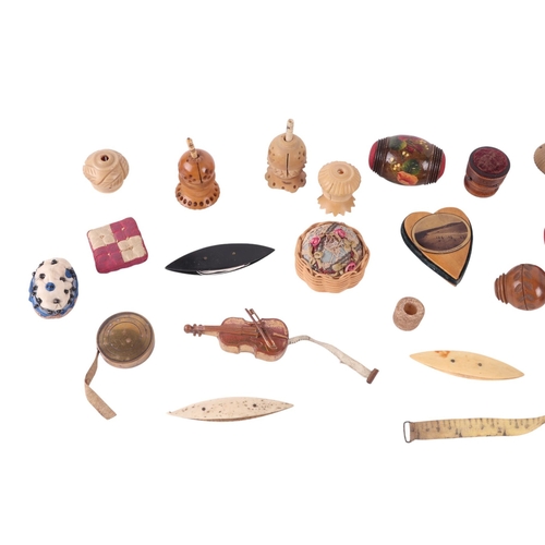 308 - A group of sewing related items to include Mauchlinware and Tunbridge ware pin cushions, novelty tap... 