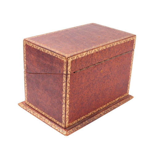 310 - A gilt tooled Moroccan leather box in the form of a run of books, 26cms wide.