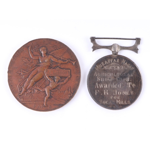 372 - A Muzaffarnagar (India) white metal Agricultural Prize Medal dated 1903; together with other medalli... 