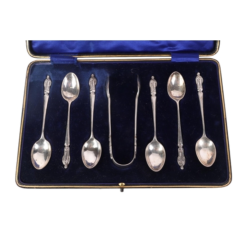 379 - A cased set of six George V silver apostle spoons and matching sugar tongs, Chester 1914, 95g.