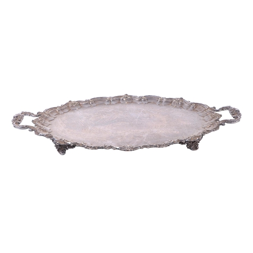 392 - A large Edwardian silver plated twin-handled tray with presentation inscription dated 1903, 73cms wi... 