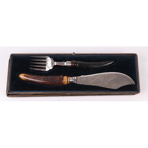 406 - A pair of Victorian silver plated serving fish knife and fork set with antler handles, cased; togeth... 