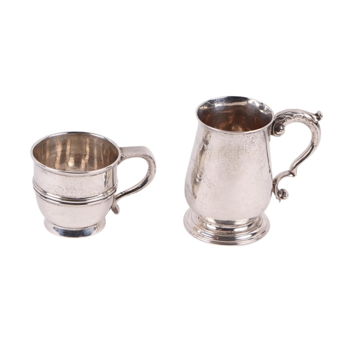 422 - A George V silver cup, London 1912, 152g; together with a white metal tankard, unhallmarked but make... 